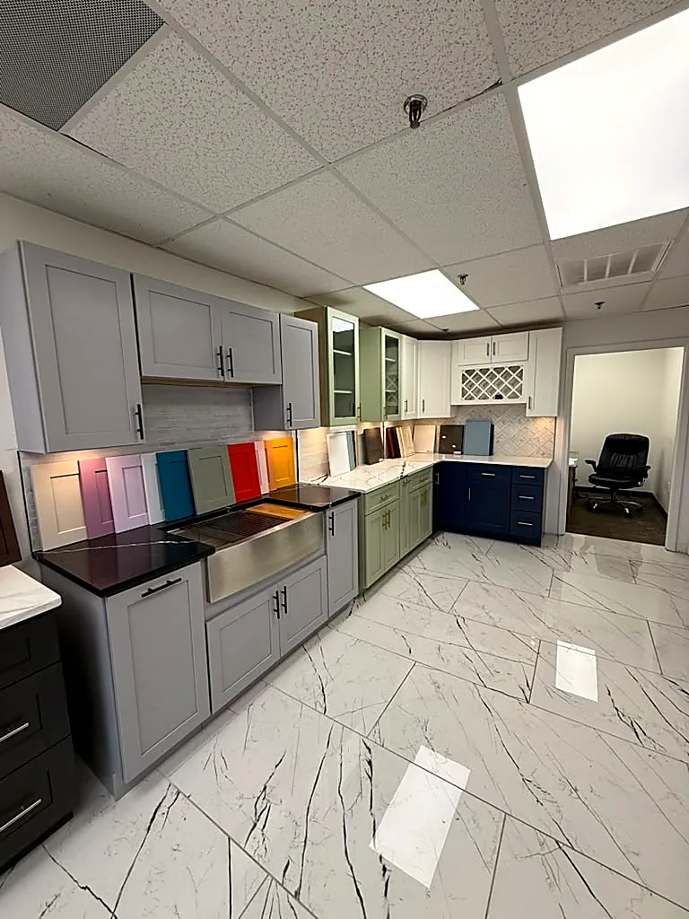 WoodArt Cabinets showroom in San Antonio — gray and navy display kitchens you can see before you finance