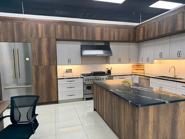 walnut and white modern kitchen with waterfall island by WoodArt Cabinets San Antonio